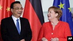 李克强2018年7月9日会见德国总理默克尔(美联社)