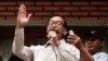 President of National Rescue Party Sam Rainsy, center, gives a speech during a public forum on the topic of the election of July 28, at their party's office in Phnom Penh, Cambodia, July 31, 2013. 