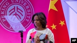 Carlos McKnight waves a flag in support of gay marriage outside of the Supreme Court in Washington, D.C.  The Court on Friday declared same-sex couples have a right to marry anywhere in the country.
