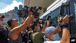 资料照片:香港新闻工作者进行拍摄工作。