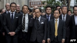 香港大律师公会成员和法律界人士游行前往中联办反对港府计划批准送中法案。(2019年6月6日)