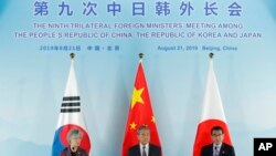 中日韩三国外长联合记者会。（2019年8月21日）