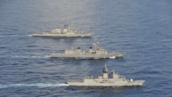 资料照片:美国第七舰队公布的照片显示,美国、日本和澳大利亚海军2020年10月19日在南中国海举行当年第五次联合演习。