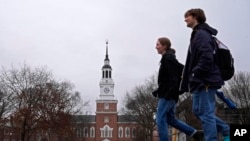 FILE - Students cross the campus of Dartmouth College, March 5, 2024, in Hanover, NH.