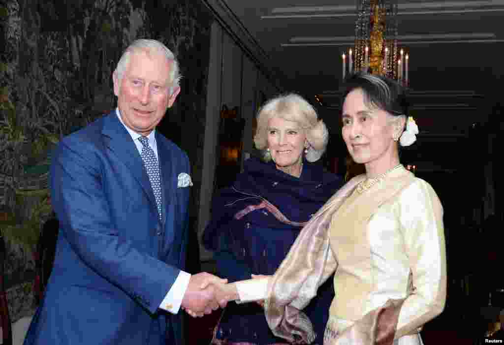 Britain's Prince Charles and Camilla, the Duchess of Cornwall meet Burma's de facto leader Aung San Suu Kyi