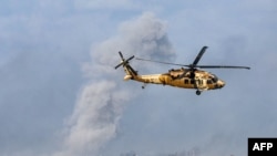 以色列军队2023年12月6日在加沙南部与哈马斯武装分子激战。(法新社)