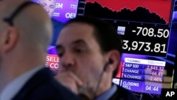 纽约股票交易所收盘前的交易商们。(2018年3月22日)