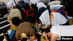 台北民众参与“万安”防空演习。(路透社2023年7月24日)