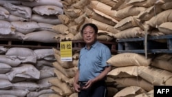 资料照:中国河北养猪农民孙大午在饲料仓库里 (2019年9月24日)