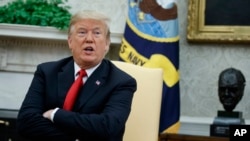 A tank drives along a street in the separatist-controlled city of Donetsk, Ukraine after Russian President Vladimir Putin ordered the deployment of Russian troops to two breakaway regions in eastern Ukraine following the recognition of their independence.