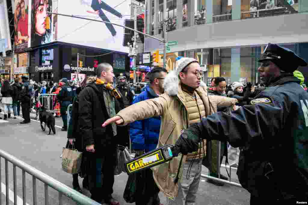 A New York Police Department (NYPD) officer secures Times Square ahead of the New Year's Eve celebrations in Manhattan, New York, Dec. 31, 2018.