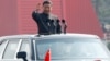 中国国家主席习近平在北京天安门广场举行的阅兵式上乘车检阅。(2019年10月1日)