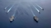 美国海军的尼米兹号和里根号航空母舰组成的双航母战斗群7月6日在南中国海航行。(美国海军提供)