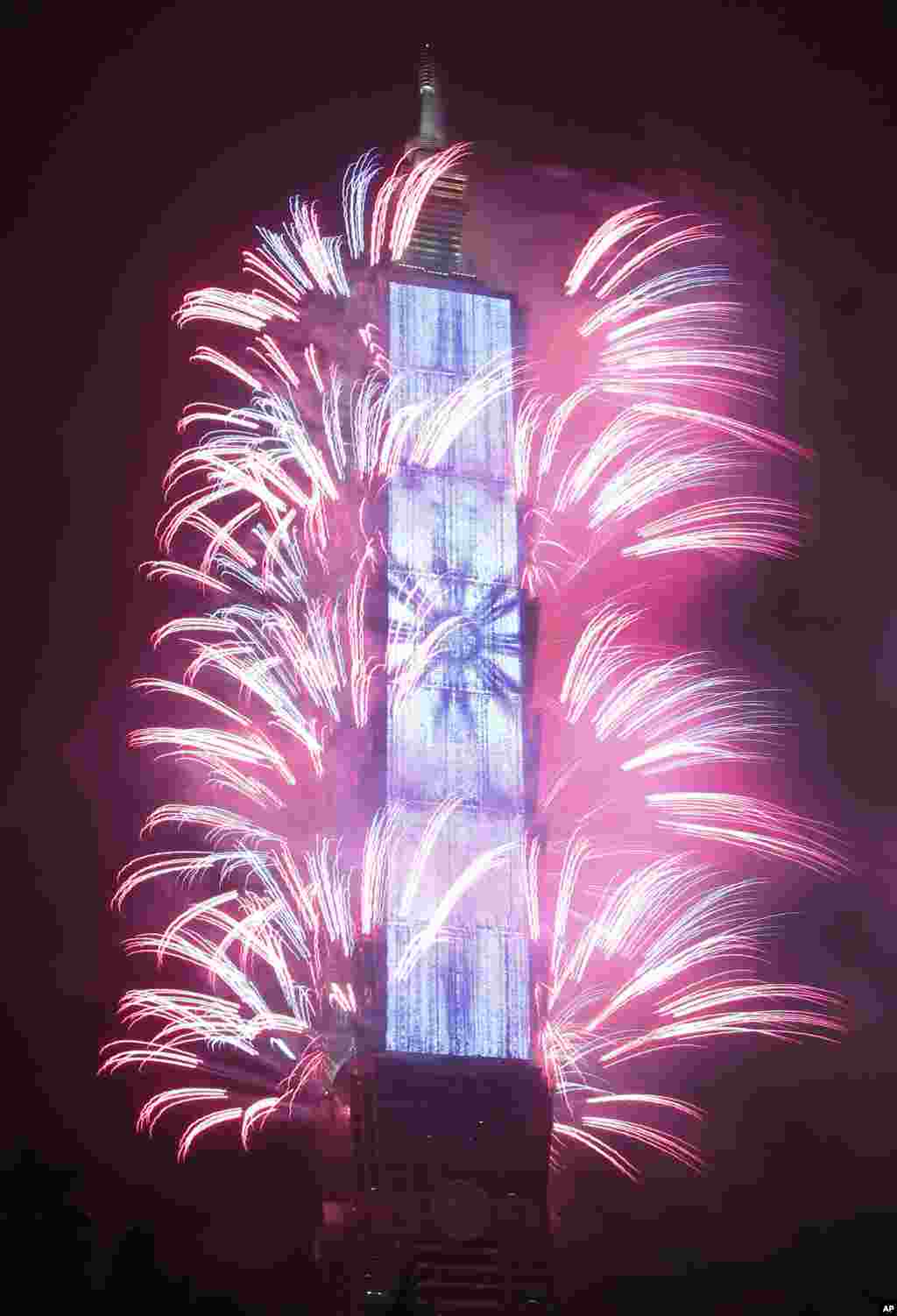 Fireworks explode from the Taipei 101 building during the New Year's celebrations in Taipei, Taiwan, Jan. 1, 2018.