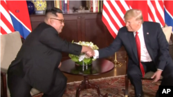 Trump Kim shaking hands 20180612