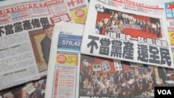 台湾媒体报道立法院通过不当党产条例的消息(美国之音张永泰拍摄)