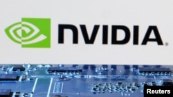 资料照:英伟达标识与芯片模板