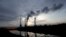 Smoke rises from chimneys of the Turow power plant located by the Turow lignite coal mine near the town of Bogatynia, Poland.