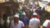 Rohingya refugees walk in market area inside a refugee camp in Ukhia on April 6, 2021 during the second day of weeklong government-imposed lockdown amid an increase of COVID-19 coronavirus cases. (Photo by Miraj KATEB / AFP)