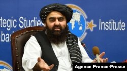 Afghanistan's acting Foreign Minister Amir Khan Muttaqi gestures while speaking during an event held in the Institute of Strategic Studies in Islamabad on Nov.12, 2021.