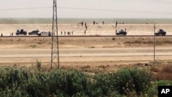 Iraq security forces withdraw from Ramadi, the capital of Iraq's Anbar province, 115 kilometers (70 miles) west of Baghdad, Sunday, May 17, 2015.