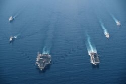 美国海军罗斯福号航母战斗群与马金岛号两栖戒备群2021年4月9日在南中国海进行编组巡航。(美国海军提供)