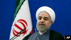 Iran's President Hassan Rouhani gives a press conference on the second anniversary of his election in Tehran, June 13, 2015.