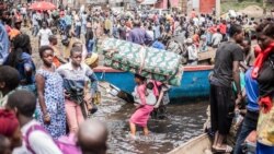 Bakimi bitumba kati na batomboki ba M23 na mampinga ma RDC na Minova bakomi na bwato na libongo lya Nzulo, na Goma, Nord-Kivu 21 sanza ya yambo 2025. AFP