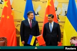 2013年12月5日,时任乌克兰总统亚努科维奇访问北京