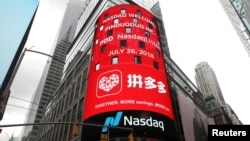 纽约时报广场广告牌播放拼多多在纳斯达克上市消息。(资料照片:2018年7月26日)