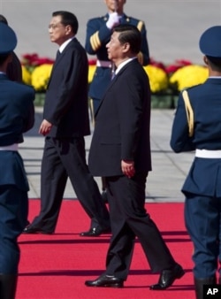 习近平和李克强在十一国庆庆典上 (图片来源:AP)