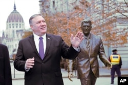 U.S. Secretary of State Mike Pompeo is pictured next to a statue of former U.S. President Ronald Reagan at the Liberty square (Szabadsag) in Budapest, Hungary, Feb. 11, 2019.