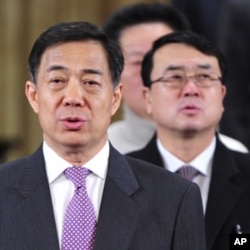 中共重庆市委书记薄熙来(左)和重庆市副市长王立军(右)(资料照)。