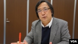 言论NPO代表工藤泰志认为,日中关系今年总体向好,但危险因素仍在,明年难料(美国之音歌篮拍摄)