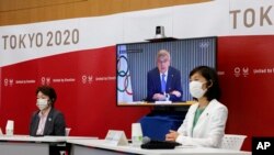 东京奥运组成员在东京召开视频会议。（2021年6月21日）