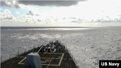 美军伯克级驱逐舰拉塞尔号(USS RUSSELL DDG-59)2021年2月17日在中国所说的南沙群岛海域航行(美国海军照片)