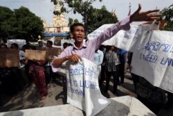 FILE - A land eviction protester shouts during a rally near the prime minister's residence in Phnom Penh, Cambodia, July 22, 2019.