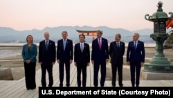 Indonesia firefighters try to extinguish a fire on fishing boats at Benoa harbour in Denpasar, on Indonesia's resort island of Bali.