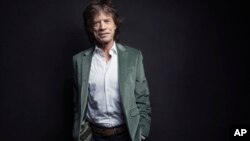 FILE - Mick Jagger of the Rolling Stones poses for a portrait in New York, Nov. 14, 2016.