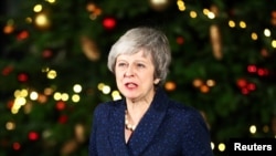 英国首相特蕾莎·梅在不信任投票举行后发表讲话。(2018年12月12日)