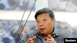 卢广2014年出席山西平遥国际摄影展。