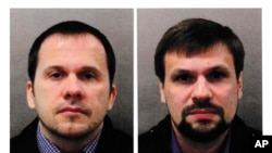 Портрети двох російських громадян, відомих як Александр Петров і Руслан Боширов, яких Велика Британія назвала російськими агентами під вигаданими іменами, що були причетні до спроби вбивства Сергія Скрипаля у Солсбері в Англії 2018 р.