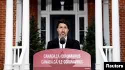 加拿大总理特鲁多于2020年3月29日在渥太华举行的关于新型冠状病毒的新闻发布会上讲话。