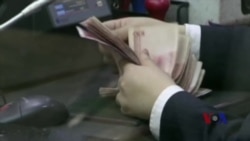 人民币国际化势头虽猛 取代美元地位尚需时日 人民币国际化势头虽猛 取代美元地位尚需时日