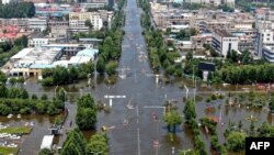 河南新乡卫辉城暴雨成灾后的街道。(2021年7月26日)