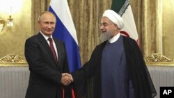 Володимир Путін і Гассан Роугані