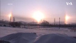 Феномен сонячних «німб» помітили у небі над ранковим містом у Китаї. Відео