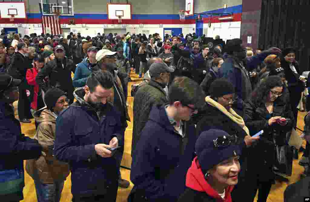 Voters line up in crowds at a polling site to cast their ballots, Nov. 8, 2016, in the Flatbush section of Brooklyn in New York.