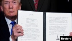 美国总统川普3月22日签署备忘录,准备对从中国进口的600亿美元商品加征关税