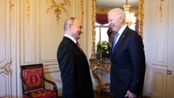 FILE - Russian president Vladimir Putin, left, talks with U.S. president Joe Biden during the U.S. - Russia summit in Geneva, Switzerland, June 16, 2021.